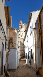 Low angle view of buildings against clear blue sky