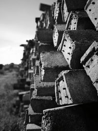 Close-up of abandoned stack against sky