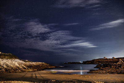 Scenic view of sea against sky at night