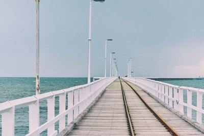 Pier over sea against sky