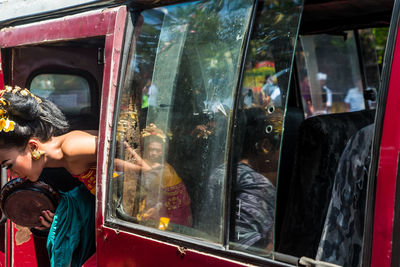 Rear view of people traveling in bus