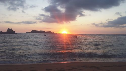 Scenic view of sea at sunset