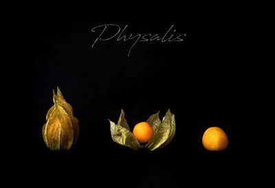 Close-up of oranges over black background