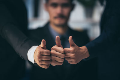 Cropped image of people with hands