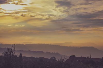 Scenic view of mountains against sky during sunset