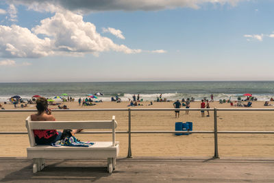 People relaxing on beach