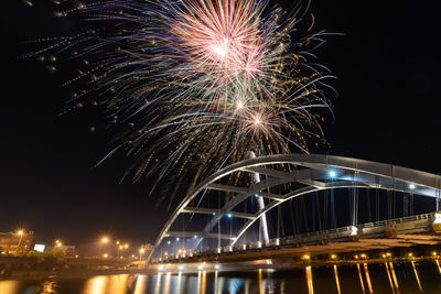 Firework display at night