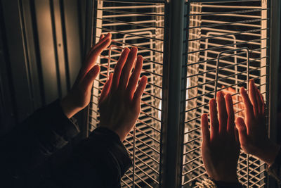 Midsection of people holding window