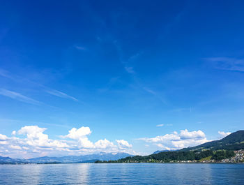 Scenic view of sea against blue sky