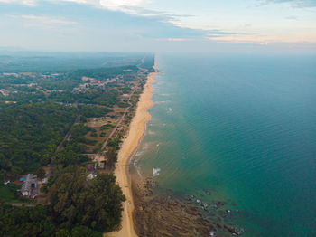 High angle view of sea and cityscape against sky