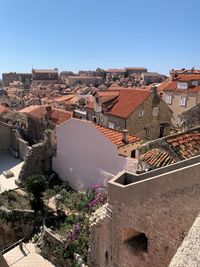 High angle view of townscape against clear blue sky