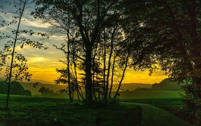 Scenic view of landscape against dramatic sky