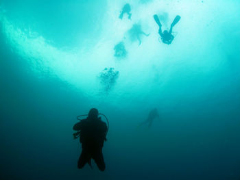 People swimming in sea