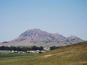 Scenic view of mountains against clear blue sky