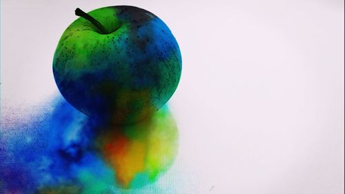 Close-up of fruits against white background