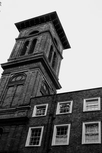 Low angle view of clock tower against sky