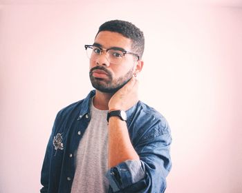 Portrait of mid adult man against white background