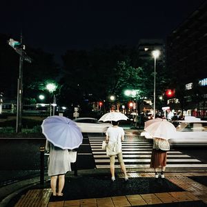 People on street at night