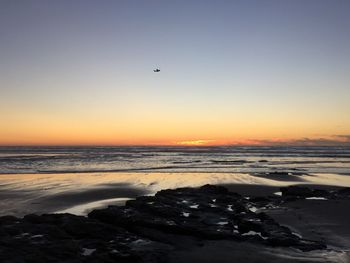 Scenic view of sea at sunset