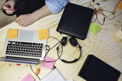 Cropped image of male blogger sitting at desk in creative office
