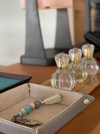 Close-up of fragrance bottles on table