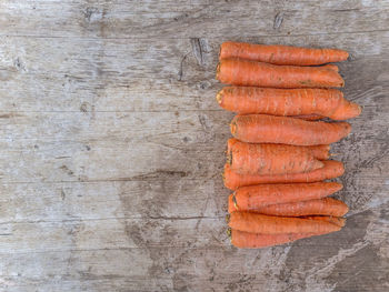 Close-up of carrots on wooden table
