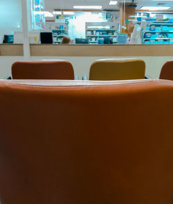 Close-up of chairs in row