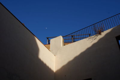 Low angle view of building against blue sky