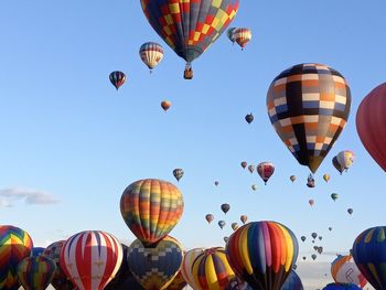 Low angle view of hot air balloons against sky