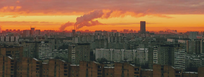 Cityscape against sky during sunset