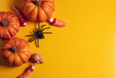 Close-up of pumpkin against yellow background