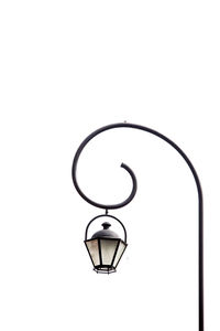 Low angle view of street light against white background