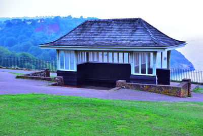 House on field against sky