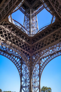 Low angle view of tower against blue sky