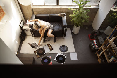 High angle view of woman sitting on table