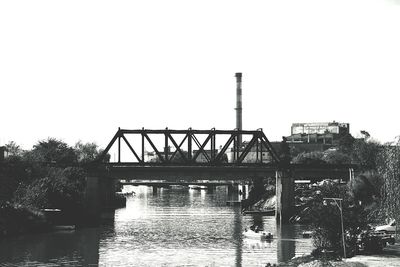 Bridge over river against clear sky