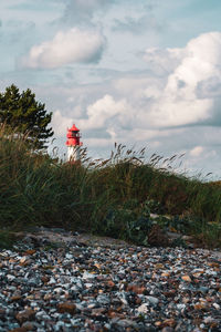 Lighthouse on the baltic sea with an overcast sky.