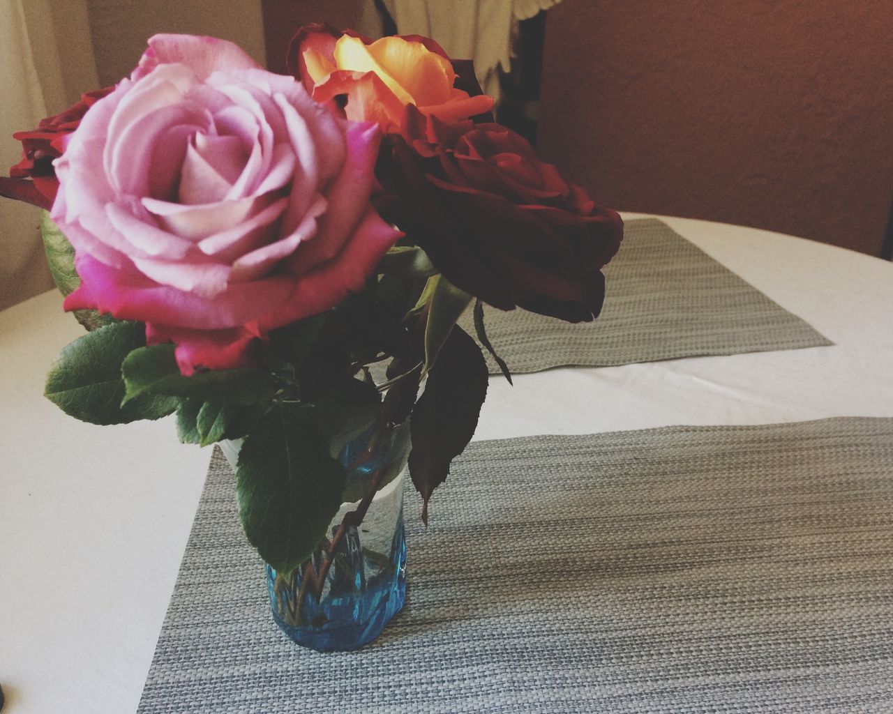 HIGH ANGLE VIEW OF ROSE BOUQUET IN POT