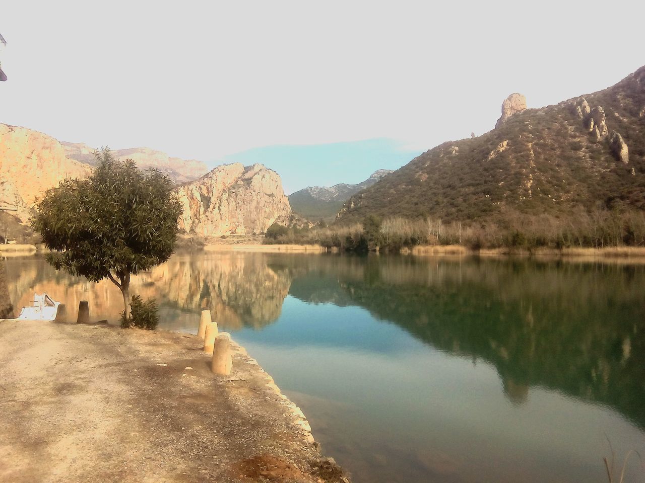 water, reflection, tree, tranquil scene, tranquility, lake, clear sky, scenics, mountain, beauty in nature, nature, sky, idyllic, day, non-urban scene, landscape, outdoors, river, waterfront, standing water