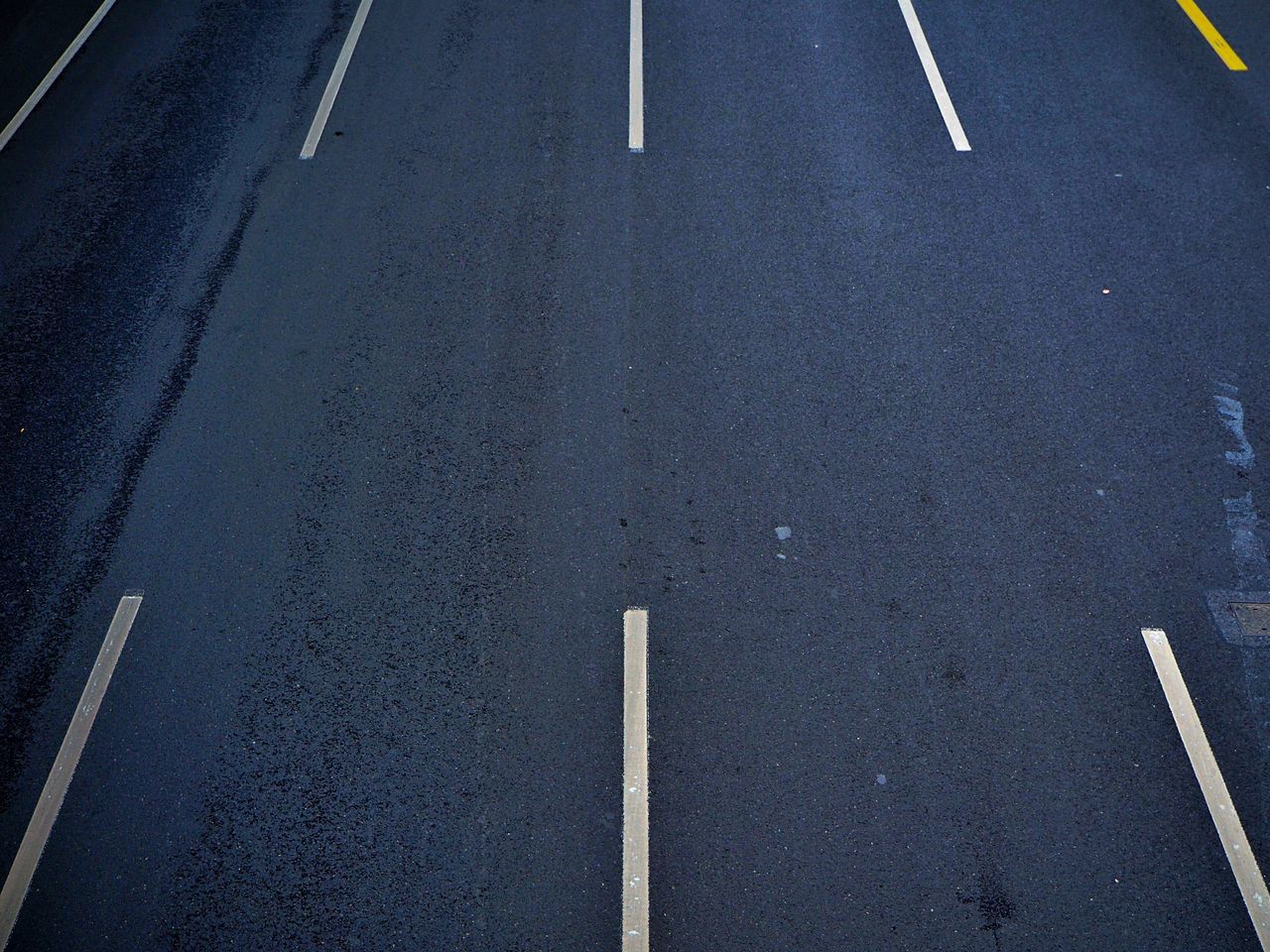 road marking, transportation, asphalt, road, street, high angle view, textured, guidance, no people, outdoors, communication, day, close-up, arrow symbol, backgrounds, full frame, pole, direction, the way forward, blue