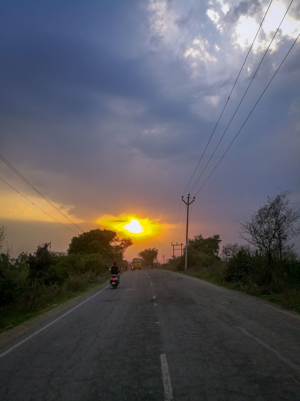 ROAD AGAINST SKY AT SUNSET