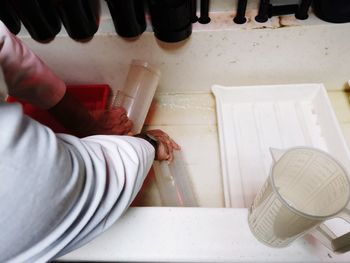 High angle view of man preparing food on table