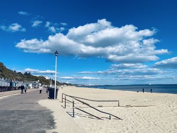 Scenic view of beach against blue sky