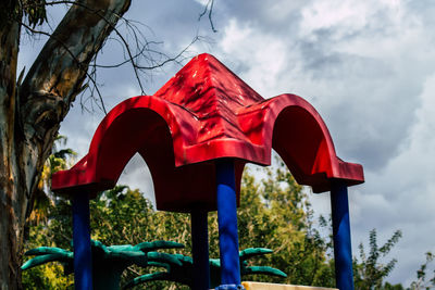 Playing equipment against trees at park