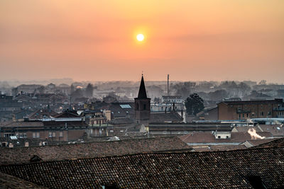 Cityscape against sky during sunset