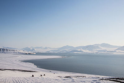 Scenic view of lake against blue sky