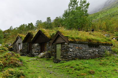 House on field against sky