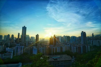 Cityscape against sky during sunset