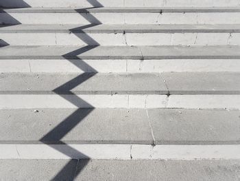 High angle view of shadow on footpath