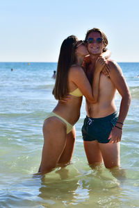 Young woman in bikini on beach